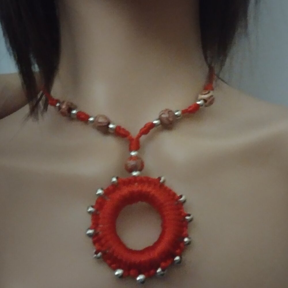 Macrame necklace Red with metal balls and wooden balls.